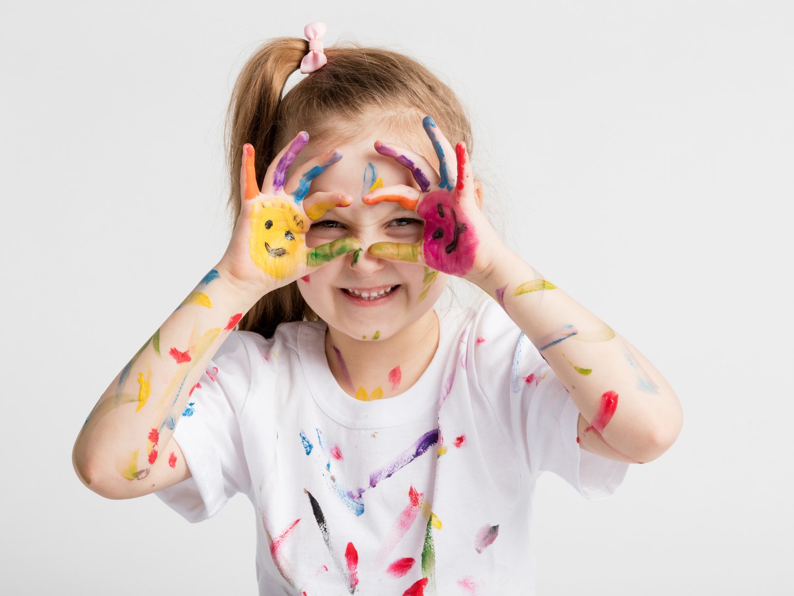 Little Girl Covered in Paint Making Funny Faces